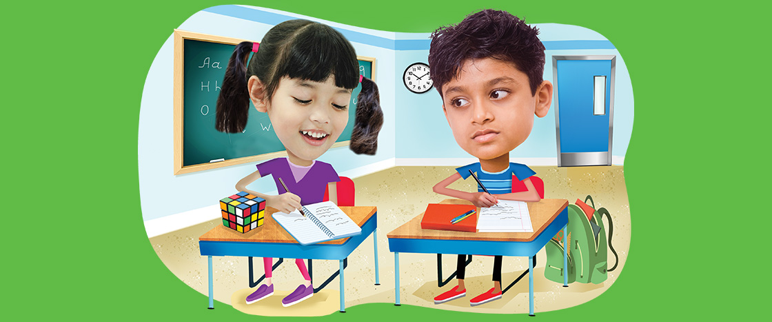 Image of two students working at their desks in a classroom